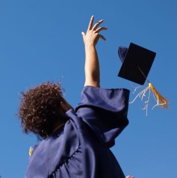 grads throwing their caps in the air