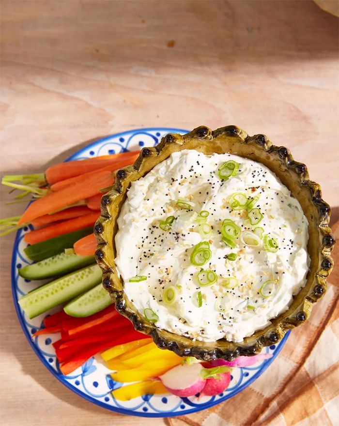 everything bagel dip served with sliced up veggies