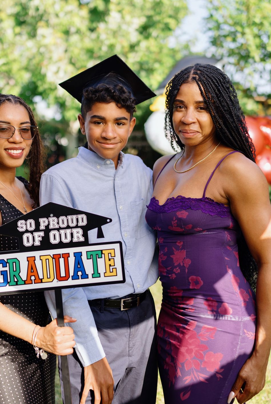 graduation photo of a happy boy and his family