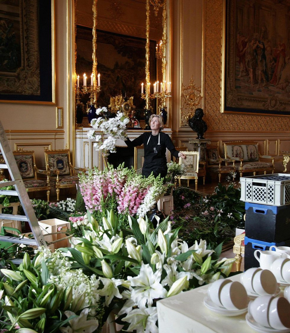 windsor, united kingdom flowers are arranged in the grand reception room in windsor castle 08 april, 2005, for the reception after the royal wedding on saturday between the prince of wales and camilla parker bowles embargoed not for publication before 0001 saturday 09 april, 2005 afp photo kirsty wigglesworth wpa rota pa photo credit should read kirsty wigglesworthafp via getty images