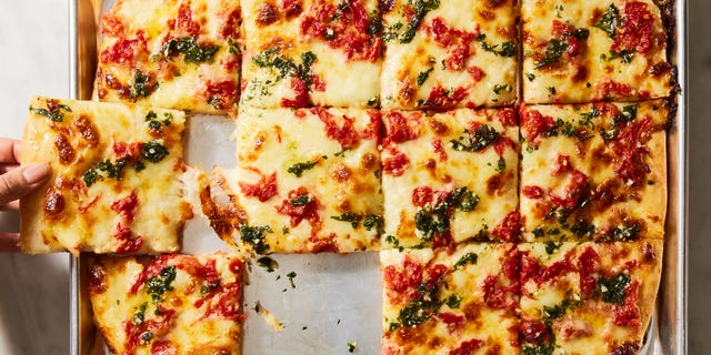 grandma pizza with basil sauce on top