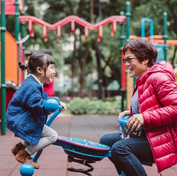 grandma playing seesaw with granddaughter