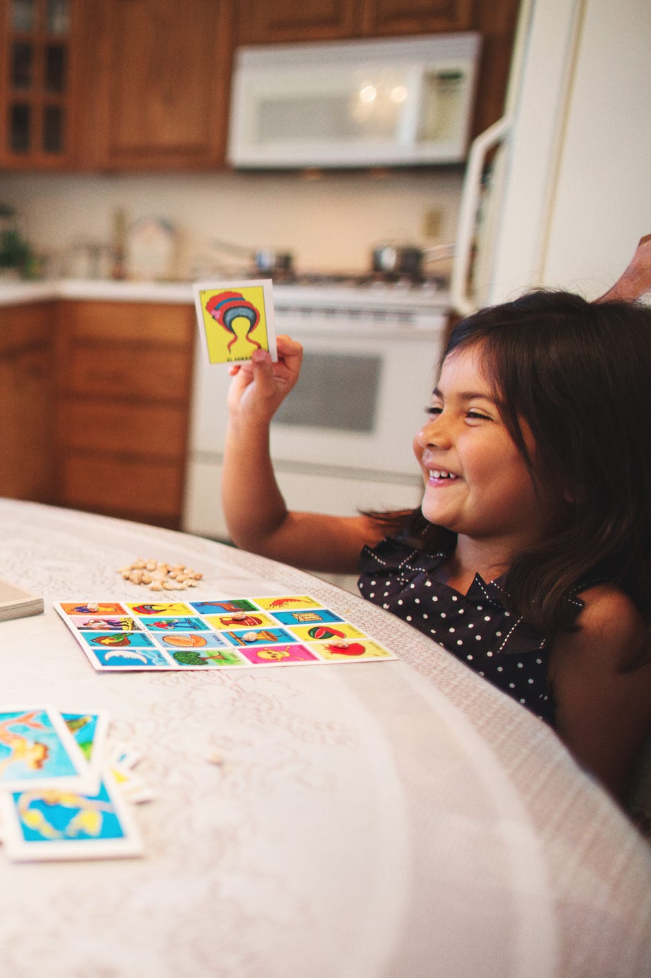 grandpa and granddaughter play loteria