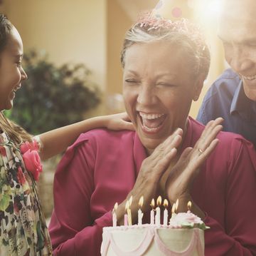 grandparents and granddaughter celebrating birthday
