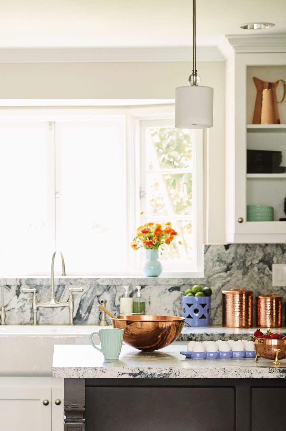 granite kitchen island with bright window