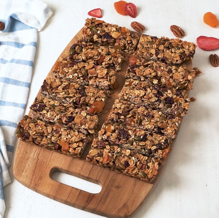 homemade granola bars on a wooden cutting board