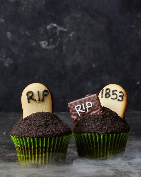 chocolate cupcakes with graveyard cookies on top