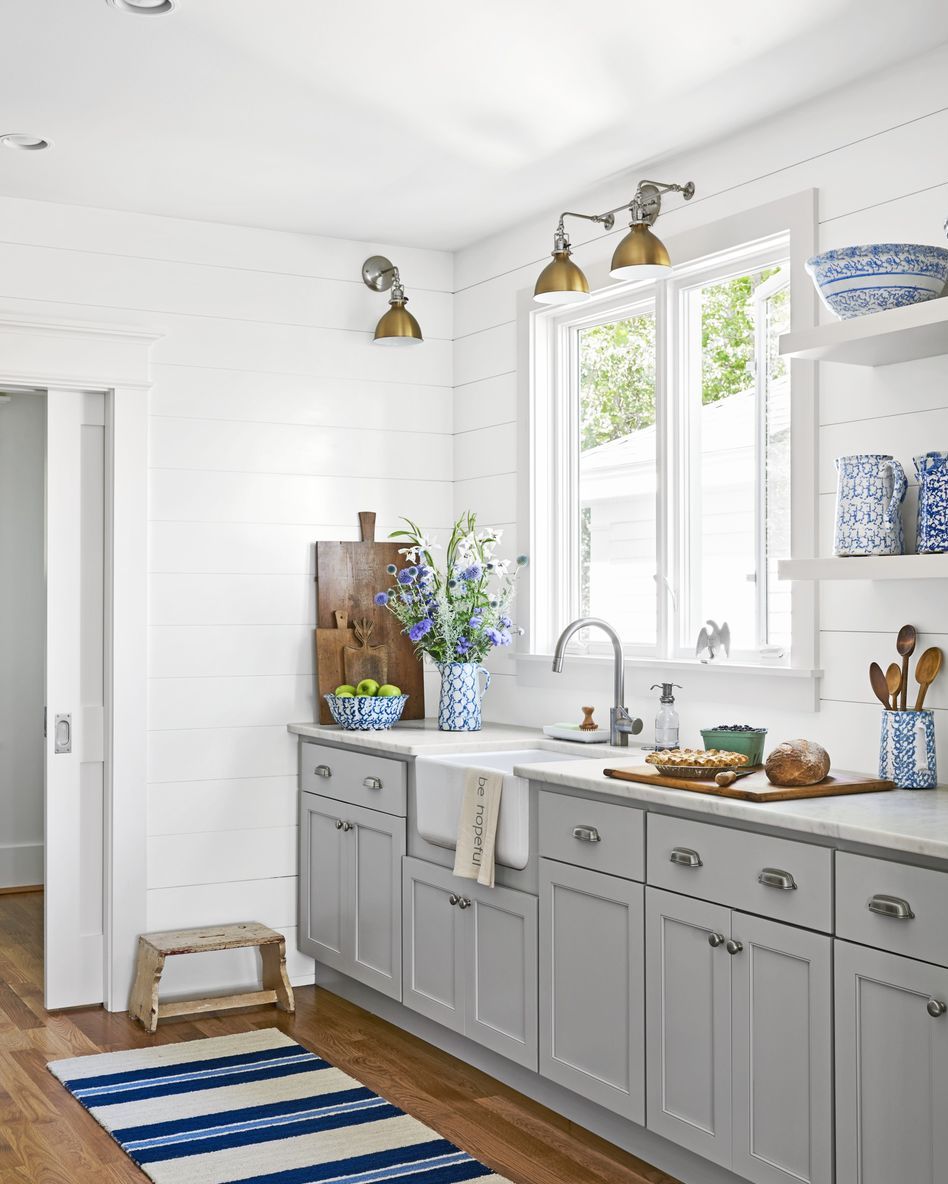 gray galley kitchen with blue and white runner on wood floors from galley kitchen design ideas