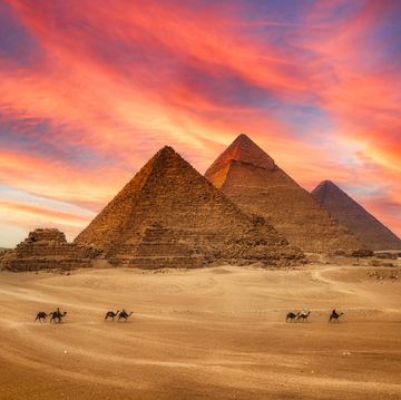 great pyramids and the camel caravan is in front of the egyptian pyramids, giza, egypt