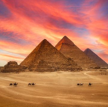 great pyramids and the camel caravan is in front of the egyptian pyramids, giza, egypt