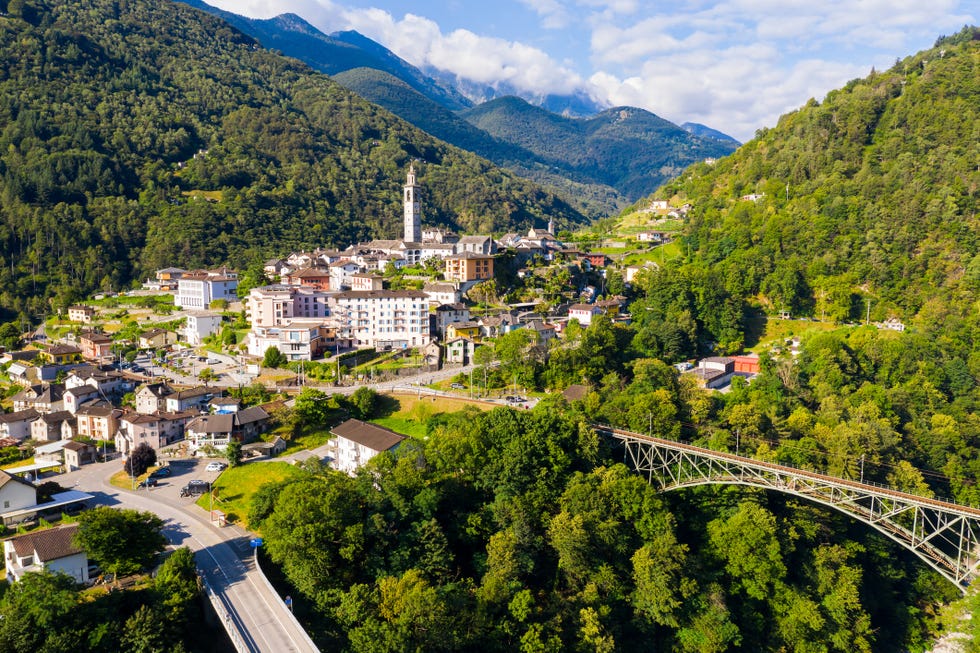 view from drone of houses of village intragna in mountain valley in sunny summer day