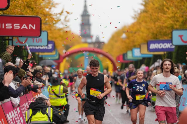 runners and cheering crowds at a race