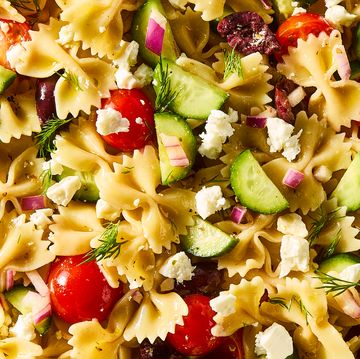 bowtie pasta tossed with cherry tomatoes, cucumbers, feta, and olives
