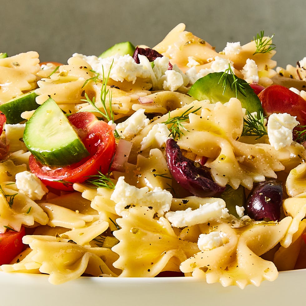 bowtie pasta tossed with cherry tomatoes, cucumbers, feta, and olives