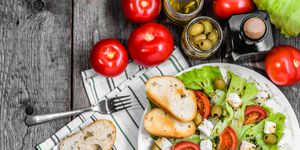 Greek salad, vegetable salads, top view on plate, vegetarian food, healthy diet concept
