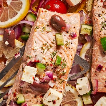 greek salmon with feta, tomatoes, lives, red onion, and cucumber
