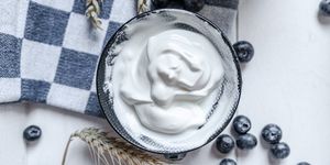yogurt in bowl on wooden table healthy eating
