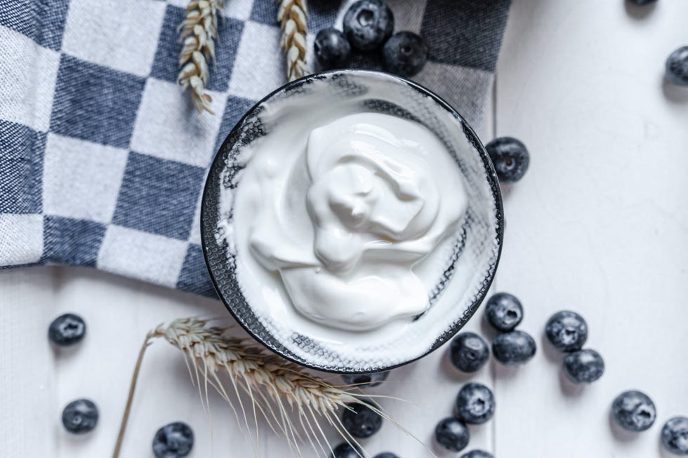 yogurt in bowl on wooden table healthy eating