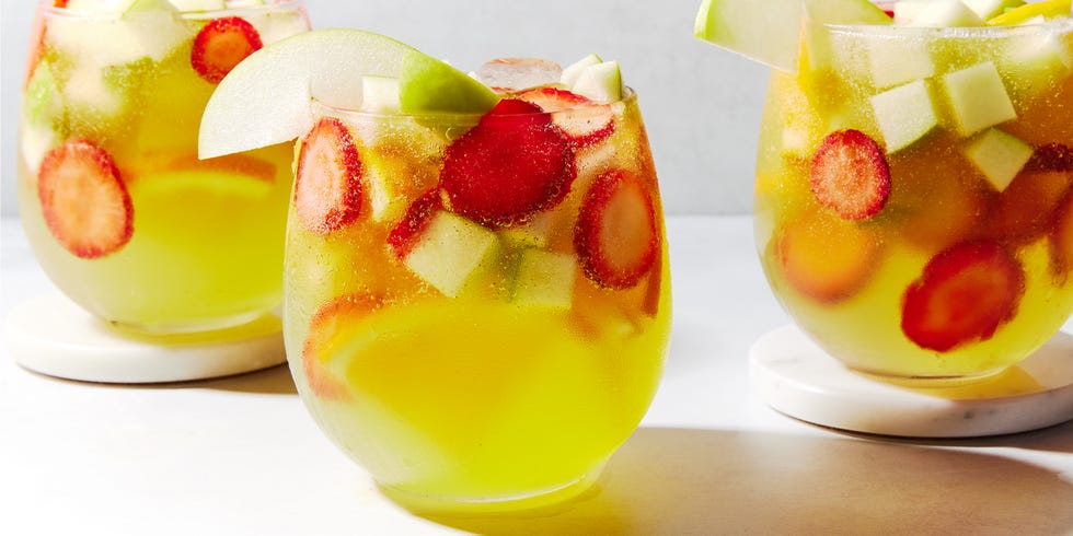 green apple moscato sangria with strawberries, oranges, and green apples