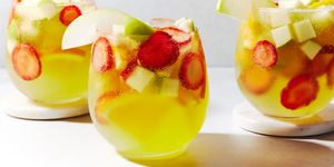 green apple moscato sangria with strawberries, oranges, and green apples