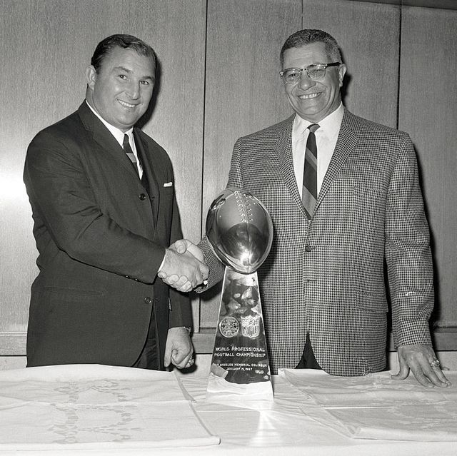 coach vince lombardi shaking hands with hank stram