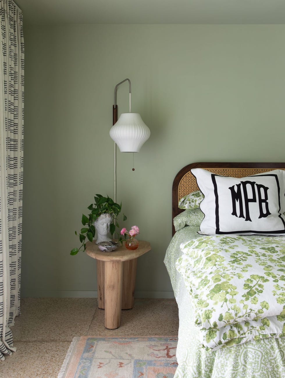 cozy bedroom corner with a bed side table and lamp