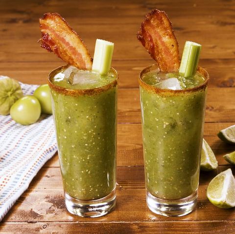 green bloody mary made with tomatillos and garnished with bacon