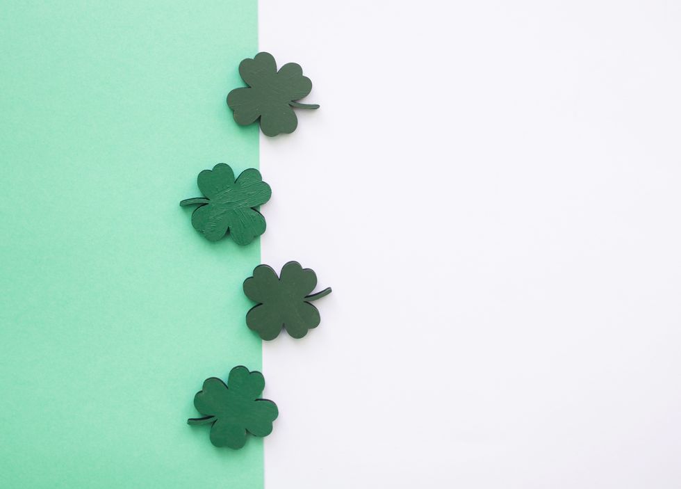 green clovers or shamrocks on white background for st patricks day holiday