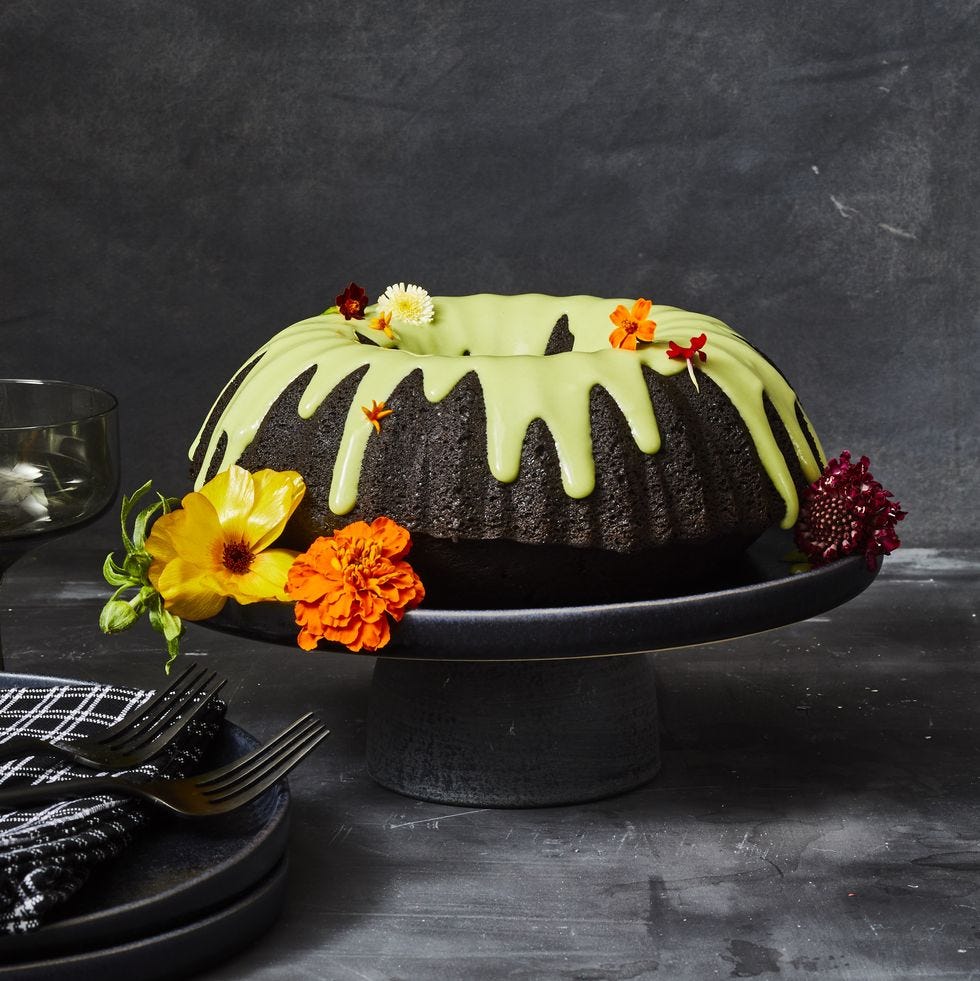 black chocolate bundt cake on a black cake stand