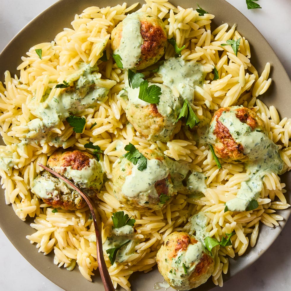meatballs served on top of orzo with creamy green goddess dressing