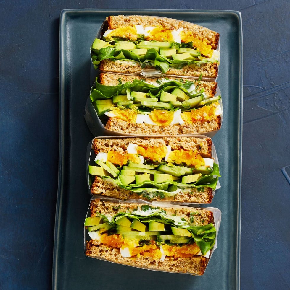 a stack of egg and avocado sandwiches