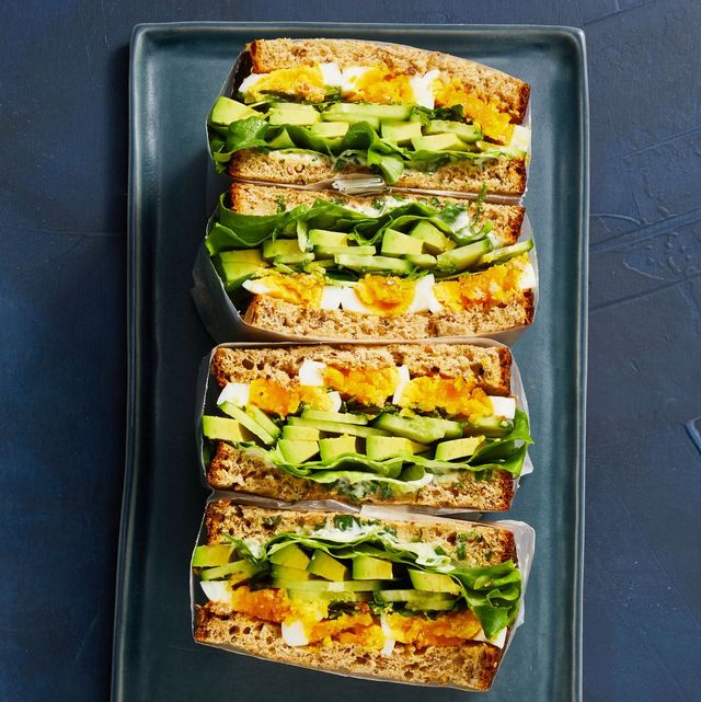 a stack of egg and avocado sandwiches
