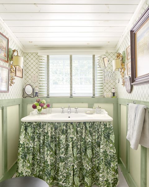 small bathroom with trellis wallpaper