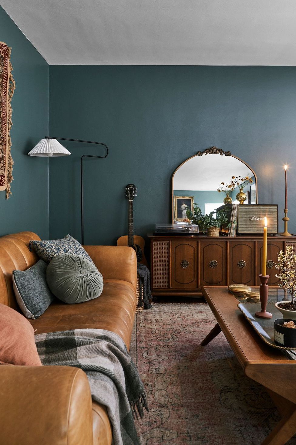 blogger ryann miller painted her living room walls a dark green color — current mood by clare paint,