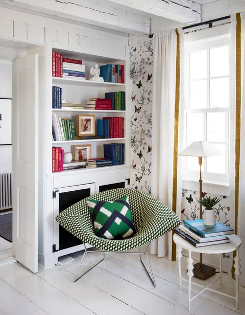living room corner with green accent chair