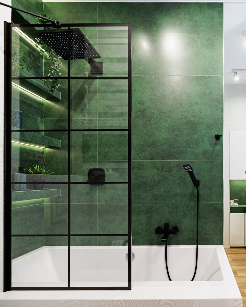 Green luxury bathroom green luxury bathroom with black hardware, stone finishes, and a live plant