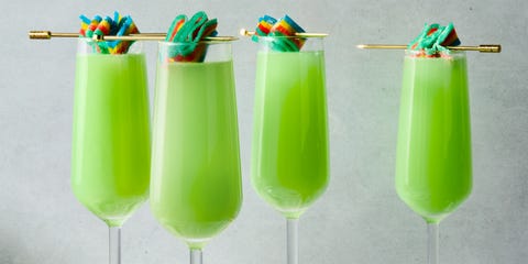 green mimosas with a sour candy garnish