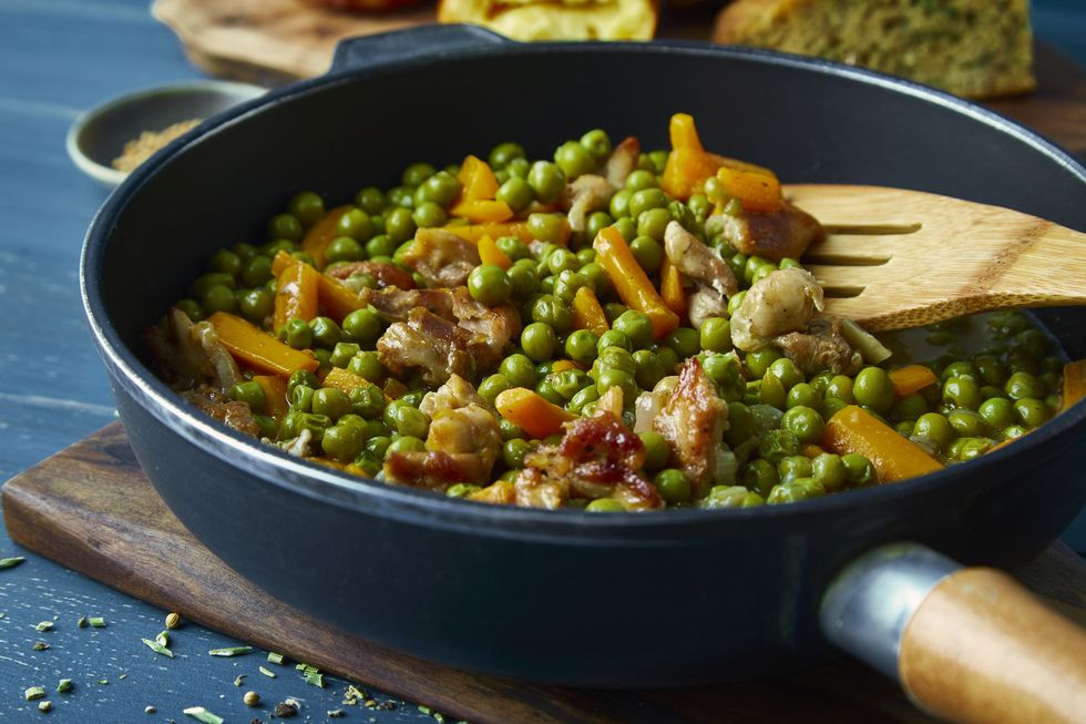 green peas with carrot and chicken meat in a pan