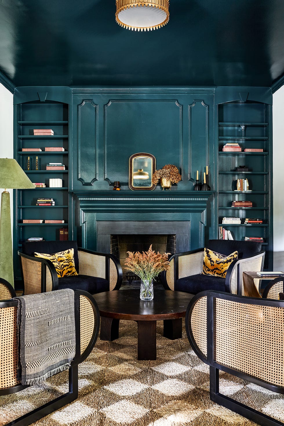 green living room with cane chairs
