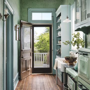 green galley kitchen and green bedroom, both in restored old farmhouses