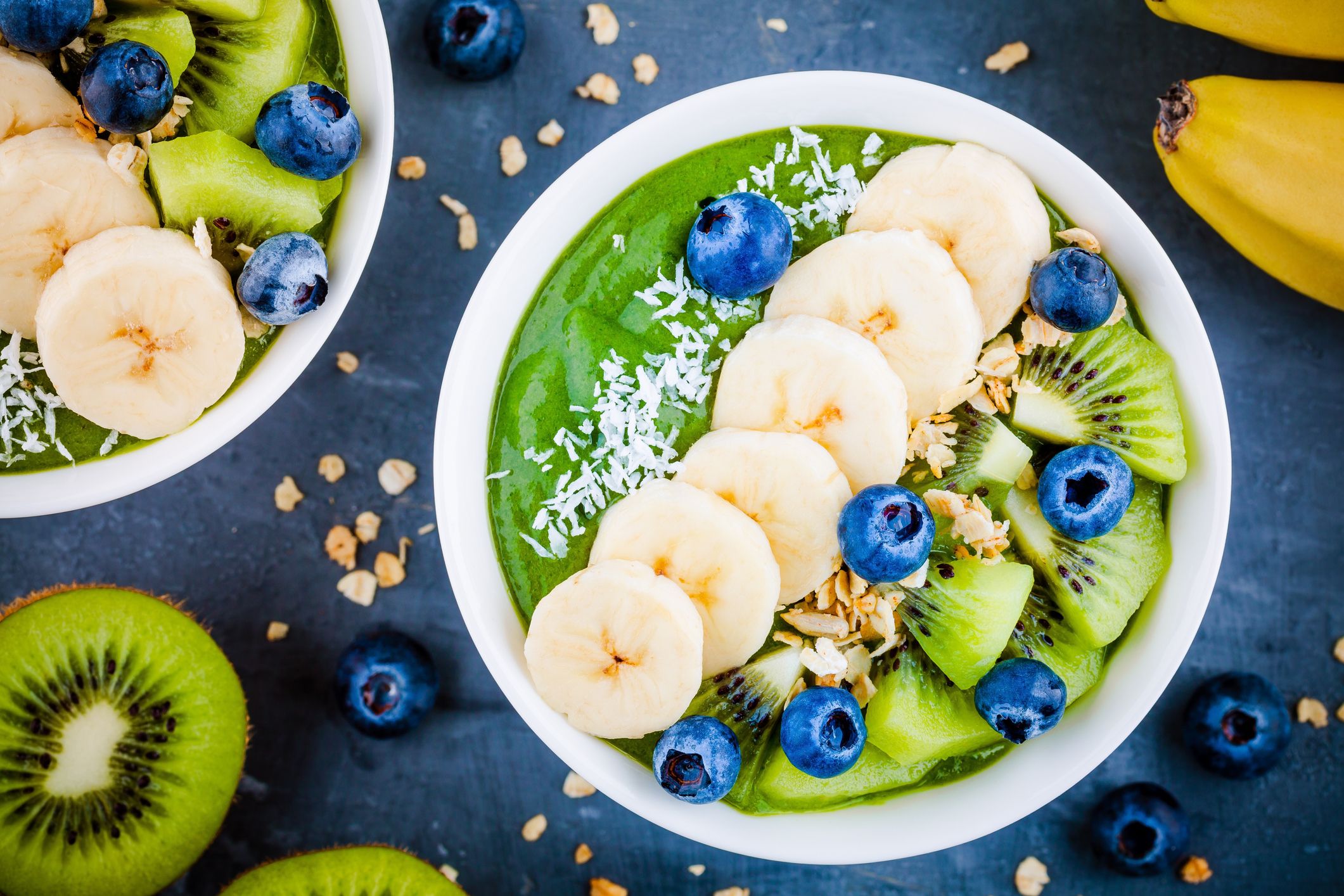 https://hips.hearstapps.com/hmg-prod/images/green-smoothie-bowl-with-banana-kiwi-blueberry-royalty-free-image-1575309438.jpg