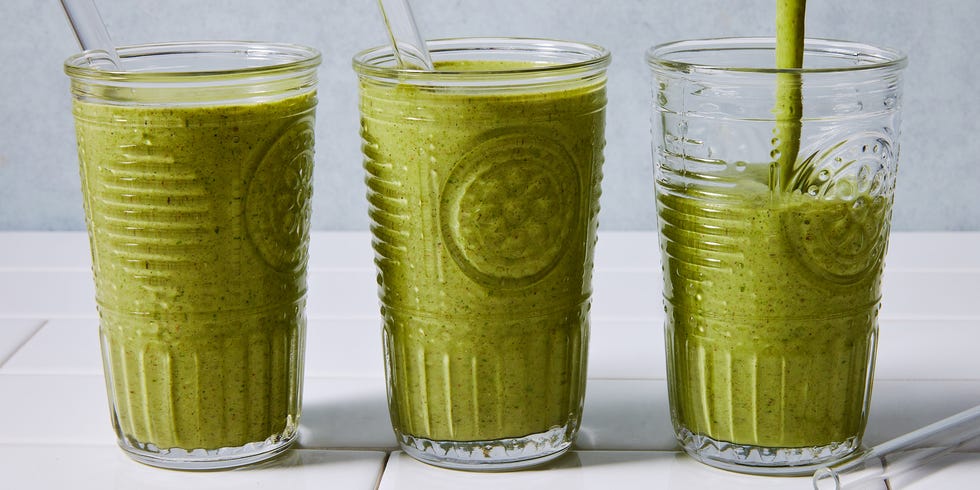 green smoothie blended in a glass