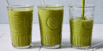 green smoothie blended in a glass