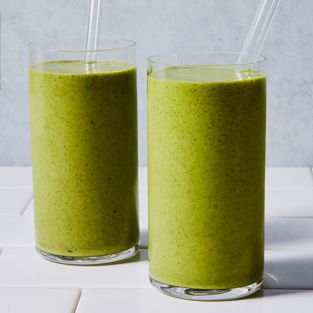 green smoothie blended in a glass