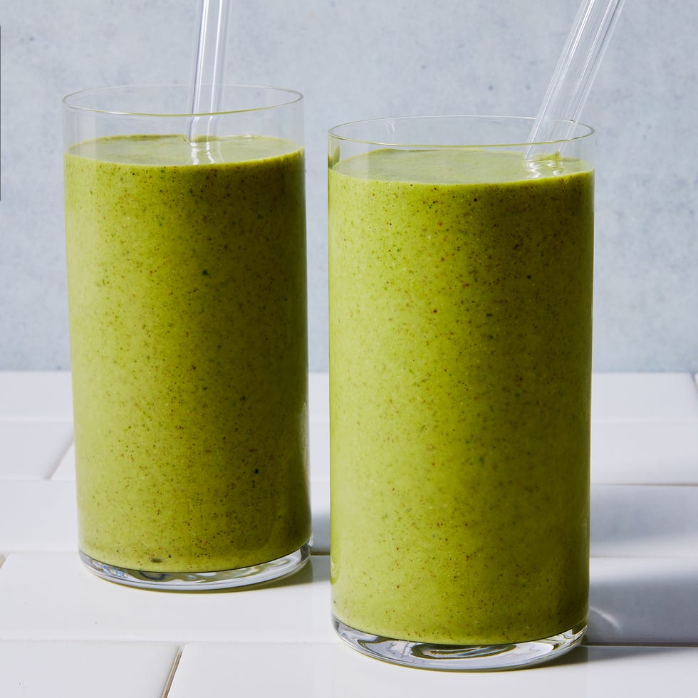 green smoothie blended in a glass