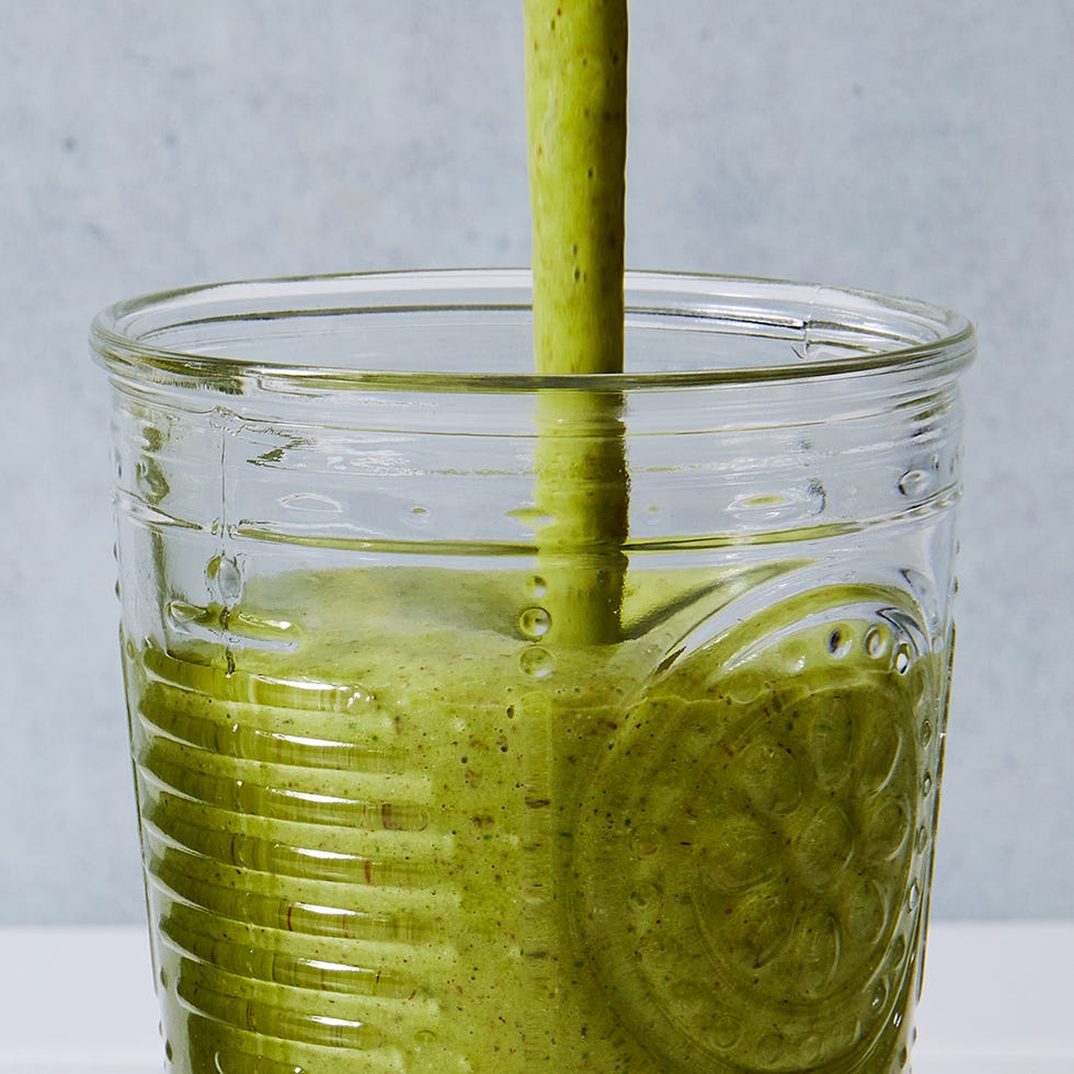 green smoothie blended in a glass