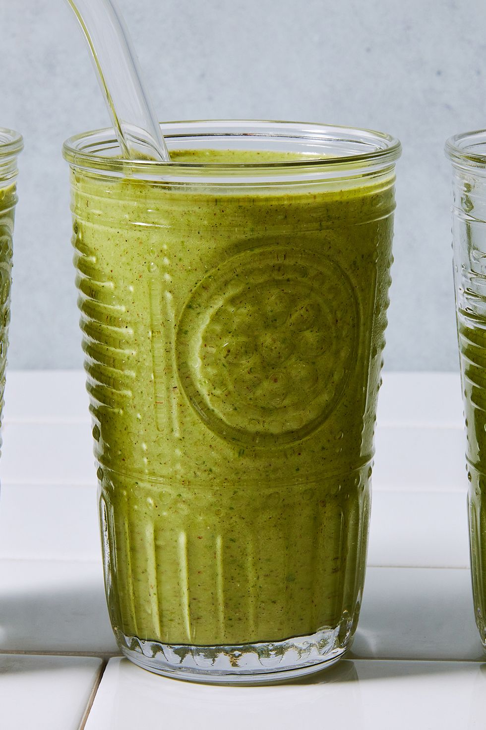 green smoothie blended in a glass