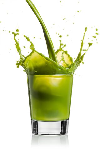 Green vegetable drink pour and splash