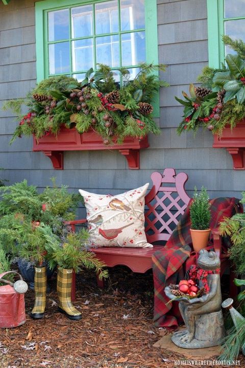 greenery and pine cone window boxes