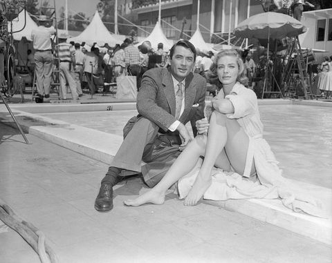 gregory peck and lauren bacall sitting by pool